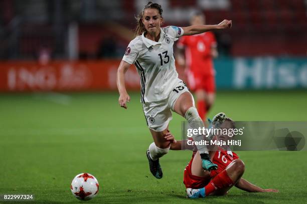 Sara Daebritz of Germany and Marina Fedorova of Russia battle for the ball during the Group B match between Russia and Germany during the UEFA...