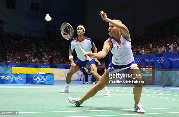 Nathan Robertson and Gail Emms of Great Britain compete against Hyojung Lee and Yongdae Lee of Korea in the mixed doubles badminton quarterfinal at...