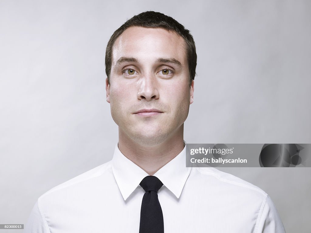 Young white man wearing a white shirt and tie 