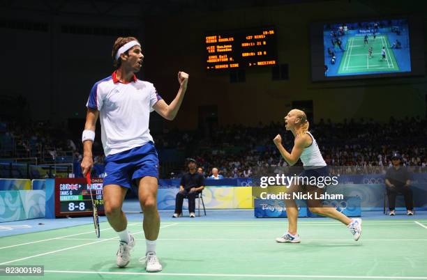 Nathan Robertson and Gail Emms of Great Britain celebrate a point as they take on Hyojung Lee and Yongdae Lee of Korea in the mixed doubles badminton...