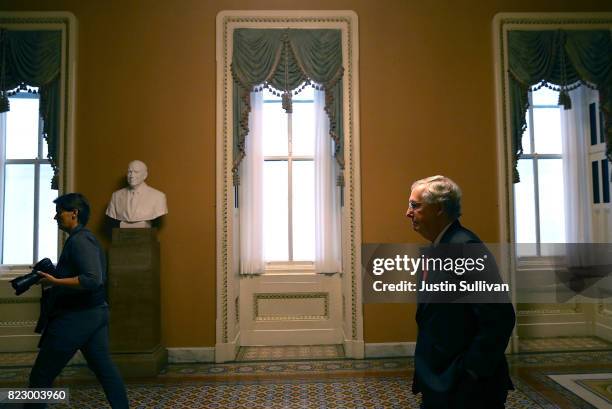 Senate Majority Leader Mitch McConnell walks to his office on July 26, 2017 in Washington, DC. The U.S. Senate will continue debate on the Better...
