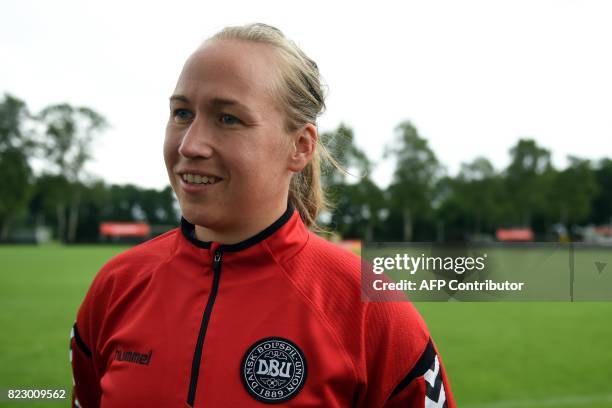 Denmark's women national football team goalkeeper Stina Lykke Petersen speaks during an interview following a training session with her team as part...