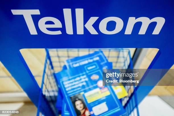 Information brochures sit on display inside a phone store operated by Telkom SA SOC Ltd. At the Menlyn Park shopping center in Pretoria, South...