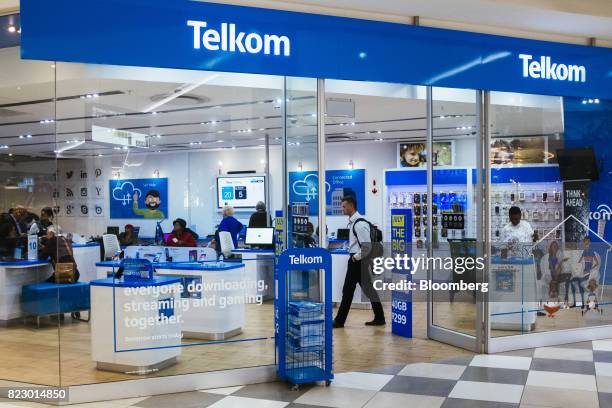 Customers visit a phone store operated by Telkom SA SOC Ltd. At the Menlyn Park shopping center in Pretoria, South Africa, on Tuesday, July 25, 2017....