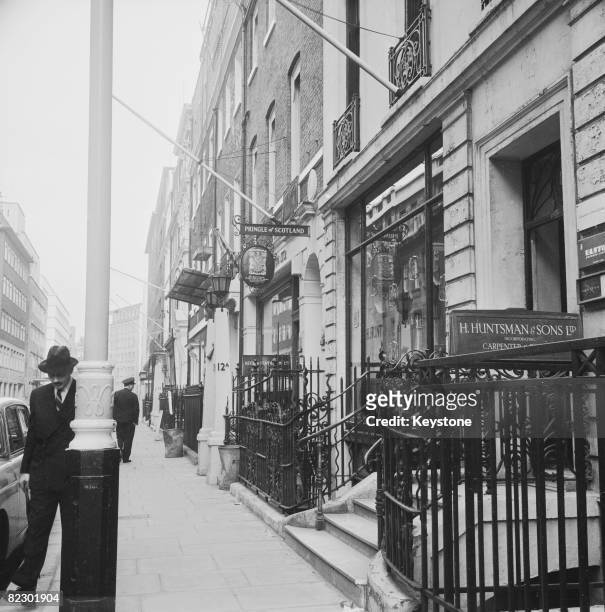 Shops on Savile Row in London, famous as the centre for quality men's suits and tailoring, 1965.