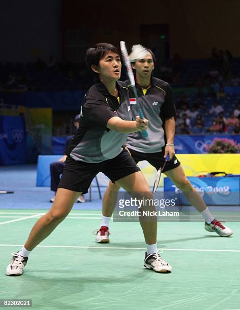 Vita Marissa and Flandy Limpele of Indonesia in action against Thomas Laybourn and Kamilla Rytter Juhl of Denmark in the mixed doubles badminton...