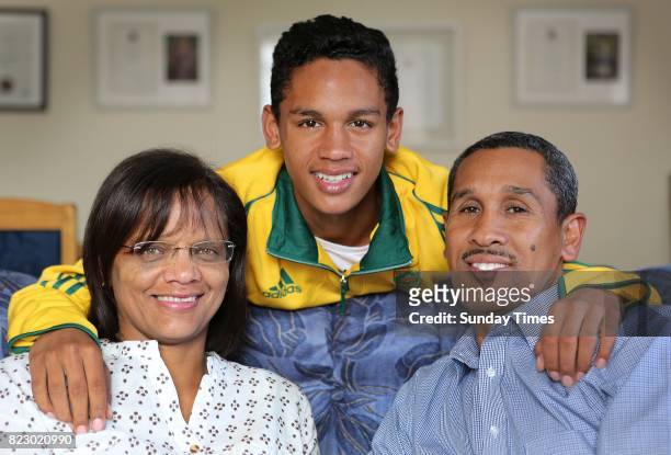 South African high jumper Breyton Poole is seen with his parents, Charmaine and Herman Poole during an interview at his home on July 20, 2017 in Cape...