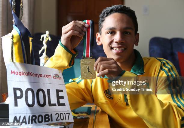 South African high jumper Breyton Poole (17 shows his gold medal during an interview at his home on July 20, 2017 in Cape Town, South Africa. The...