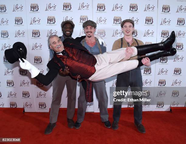 Puppeteers hold ringmaster Willy Whipsnade as they arrive at the opening night of "CIRCUS 1903" at Paris Las Vegas on July 25, 2017 in Las Vegas,...