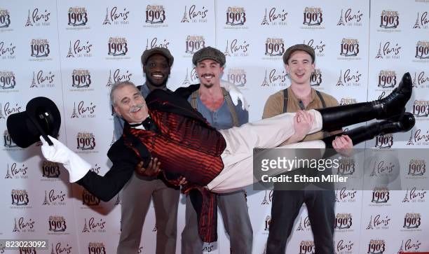 Puppeteers hold ringmaster Willy Whipsnade as they arrive at the opening night of "CIRCUS 1903" at Paris Las Vegas on July 25, 2017 in Las Vegas,...