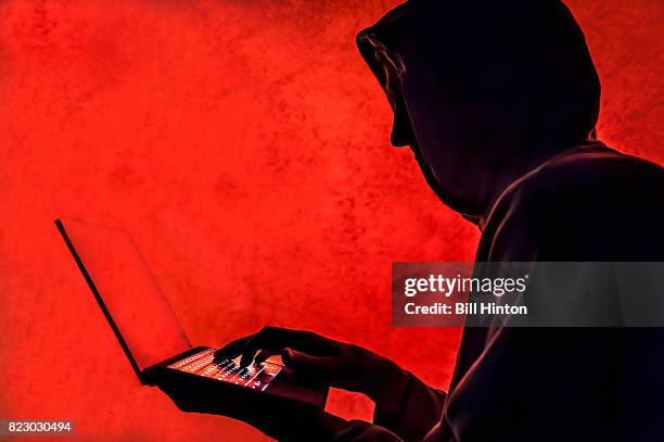 cyber hacker red - anonymous hacker stock-fotos und bilder