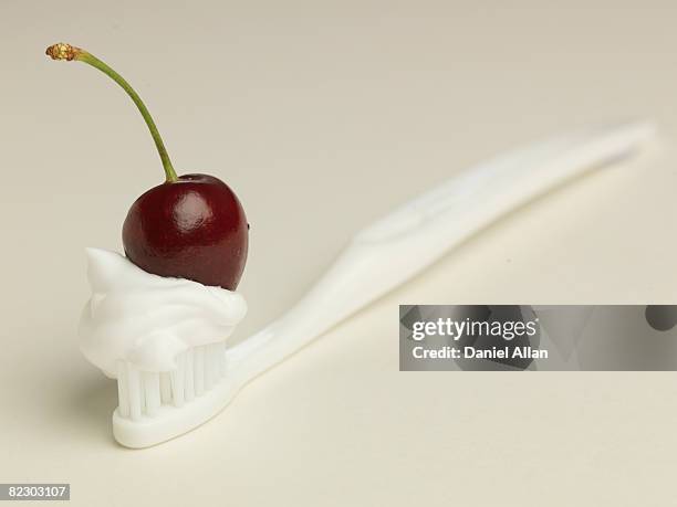 cherry and toothbrush - cherry on top stock-fotos und bilder