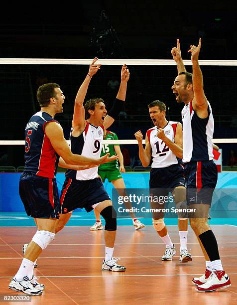 Richard Lambourne, Ryan Millar, and Thomas Hoff and Lloy Ball of the United States celebrate after defeating Bulgaria during the men's volleyball...