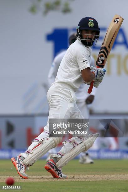 Indian cricketer Cheteshwar Pujara plays a shot during the 1st Day's play in the 1st Test match between Sri Lanka and India at the Galle...
