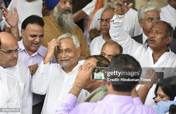 Bihar Chief Minister Nitish Kumar leaves after swearing in ceremony of the new president Ram Nath Kovind at Parliament House on July 25, 2017 in New...