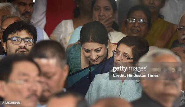 Union Textile Minister Smriti Irani talking with Kiren Bedi Lieutenant Governor of Puducherry after swearing in ceremony of the new president Ram...