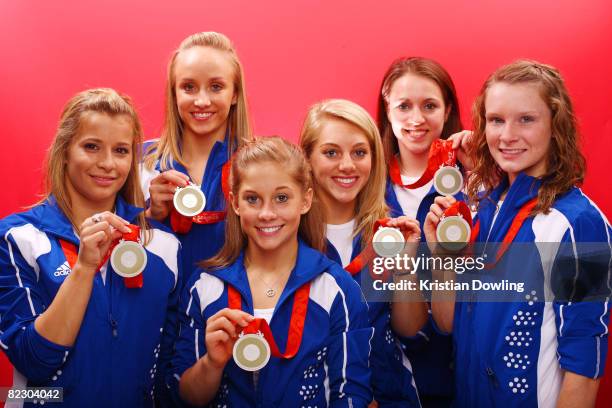 Alicia Sacramone, Nastia Liukin, Shawn Johnson, Samantha Peszek, Chellsie Memmel and Bridget Sloan of the United States pose together with their...