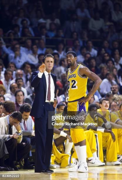 Finals: Los Angeles Lakers coach Pat Riley talking to Earvin Magic Johnson during game vs Boston Celtics at The Forum. Game 3. Inglewood, CA 6/2/1985...