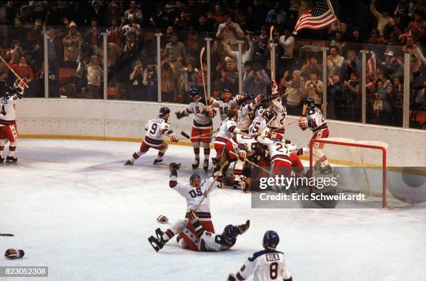 Winter Olympics: Overall view of Team USA players victorious on ice after winning Medal Round game vs USSR at Olympic Fieldhouse in the Olympic...