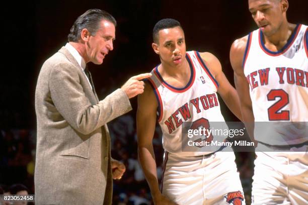 New York Knicks John Starks and Monty Williams with coach Pat Riley during preseason game at Nassau Coliseum. Starks listening to Riley. Uniondale,...