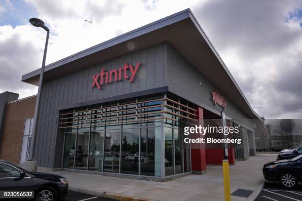 Comcast Corp. Xfinity store stands in King Of Prussia, Pennsylvania, U.S., on Tuesday, July 25, 2017. Comcast Corp. Is scheduled to release earning...