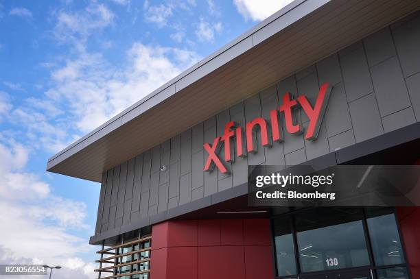 Signage is displayed on the exterior of a Comcast Corp. Xfinity store in King Of Prussia, Pennsylvania, U.S., on Tuesday, July 25, 2017. Comcast...