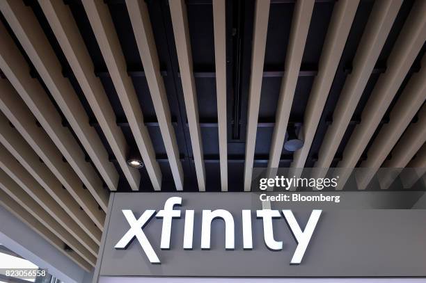 Signage hangs on display inside a Comcast Corp. Xfinity store in King Of Prussia, Pennsylvania, U.S., on Tuesday, July 25, 2017. Comcast Corp. Is...