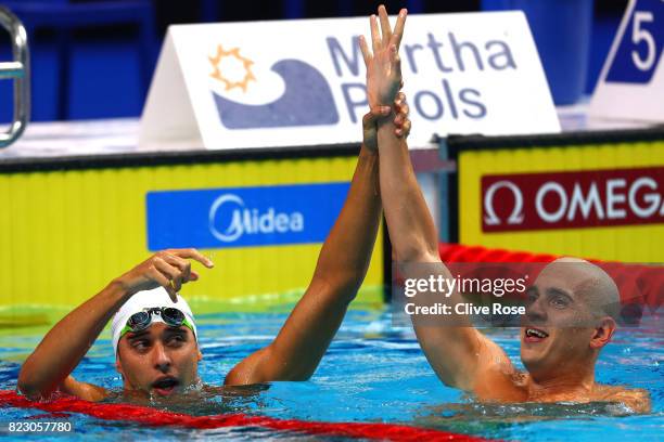 Gold medalist Chad Le Clos of South Africa and silver medalist Laszlo Cseh of Hungary celebrate following the Men's 200m Butterfly final on day...