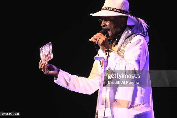 Larry Graham holds up a Graham Central Station CD when he performs during the "Dave Koz and Larry Graham: Side By Side Summer 2017" Tour at Mayo...