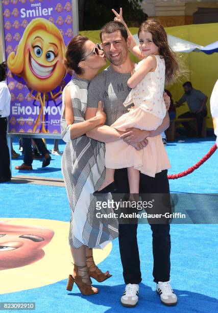 Actor Max Greenfield, wife Tess Sanchez and daughter Lilly Greenfield arrive at the premiere of 'The Emoji Movie' at Regency Village Theatre on July...