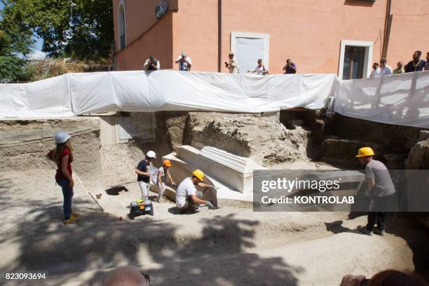 Restorers work on a notable newly discovered Roman tomb in the archaeological area of Pompeii, the ancient Roman town was buried in 79 AD by the...