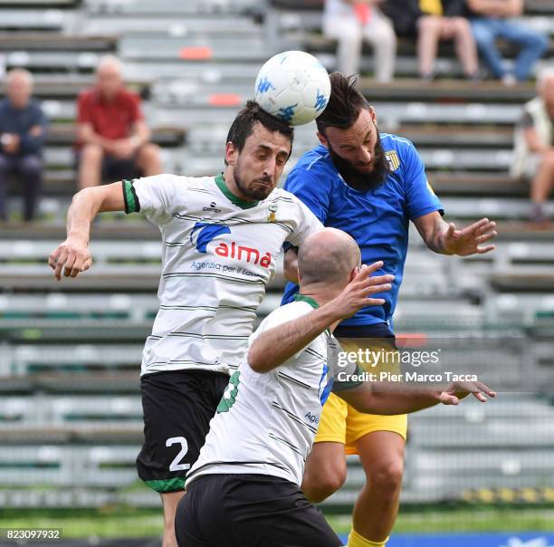 Thomas Pizzini of Settaurense competes for the ball with Manuel Nocciolini during the pre-season friendly match between Parma Calcio and Settaurense...