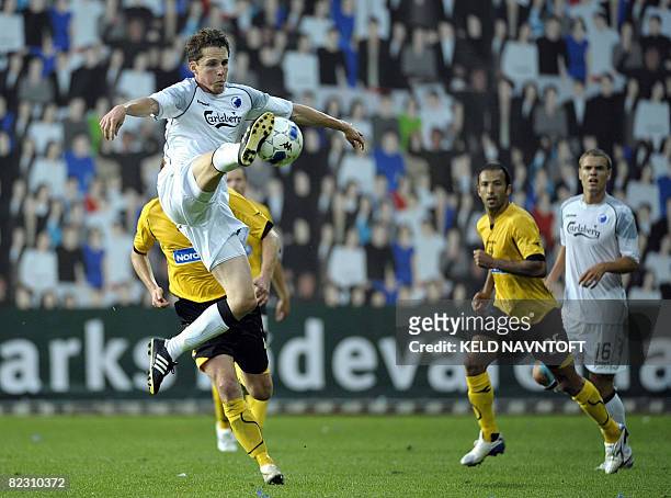 Morten Nordstrand of FCK traps the ball as Khaled Essediri of Lillestrom and Thomas Kristensen of FCK look on during their UEFA Cup second round...