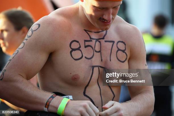 Participant prepares to take part in Tough Mudder Long Island at the Old Bethpage Village Restoration on July 22, 2017 in Old Bethpage, New York.