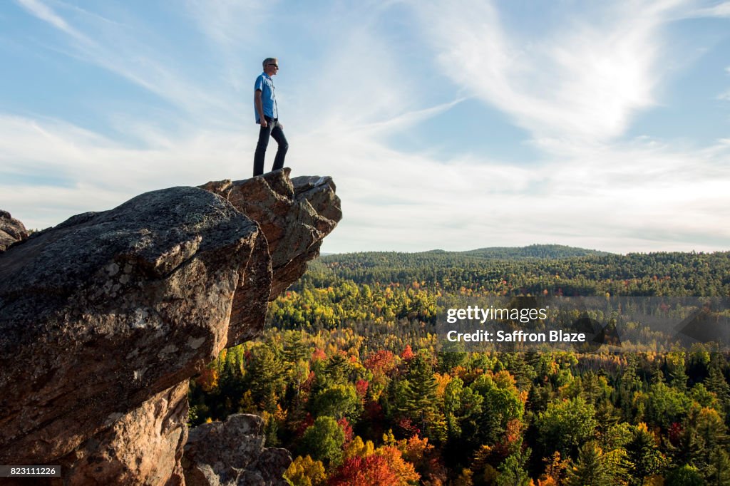 A man on the edge of a cliff.