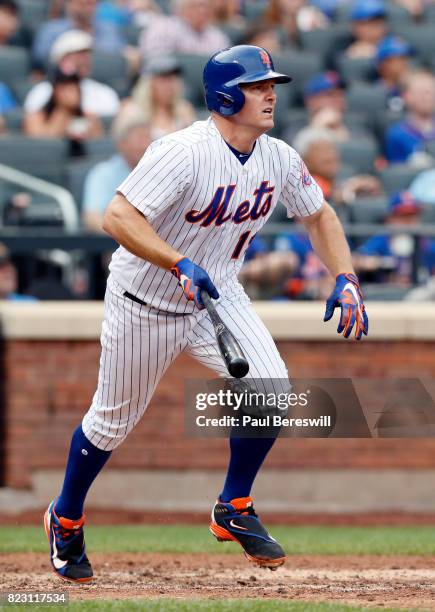 Jay Bruce of the New York Mets runs up the line watching the ball after batting in an interleague MLB baseball game against the Oakland Athletics on...