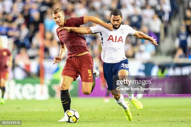 Roma forward Edin Dzeko and Tottenham Hotspur defender Cameron Carter-Vickers battle for the ball during the International Champions Cup between...