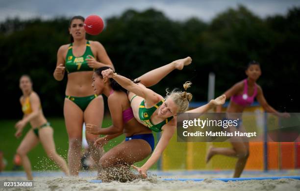 Heather Cooper of Australia is challenged by Nien-En Hsieh of Chinese Taipei during the Beach Handball Women's Group B match between Australia and...