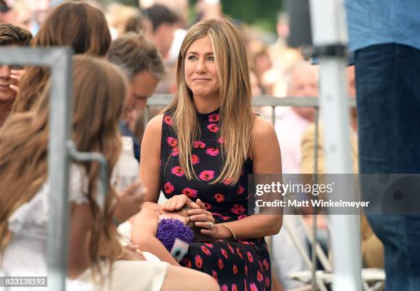 Jennifer Aniston with Jason Bateman's daughter Maple Bateman attend The Hollywood Walk of Fame Star Ceremony honoring Jason Bateman on July 26, 2017...