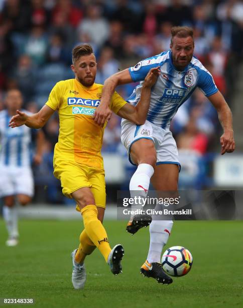 Laurent Depoitre of Huddersfield Town in action with Silvan Widmer of Udinese during the pre season friendly match between Huddersfield Town and...