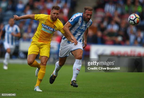 Laurent Depoitre of Huddersfield Town in action with Silvan Widmer of Udinese during the pre season friendly match between Huddersfield Town and...