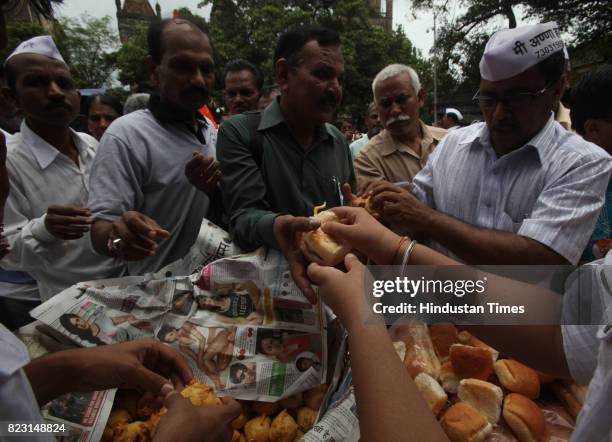 Supporter's of Anna Hazare distributed free vada pav to the supporter who had come to protest at the Azad Maidan in Mumbai on Sunday.