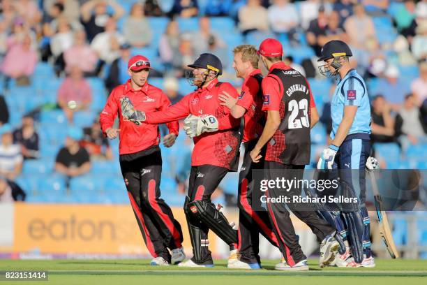 Stuart Poynter of Durham is congartulates by Durham team after stumping Peter Handscomb of Yorkshire during the NatWest T20 blast between Yorkshire...