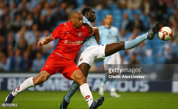 Felipe Caicedo of Manchester City stretches for the ball under pressure from Winston Reid of FC Midtjylland during the UEFA Cup 2nd Qualifying Round...