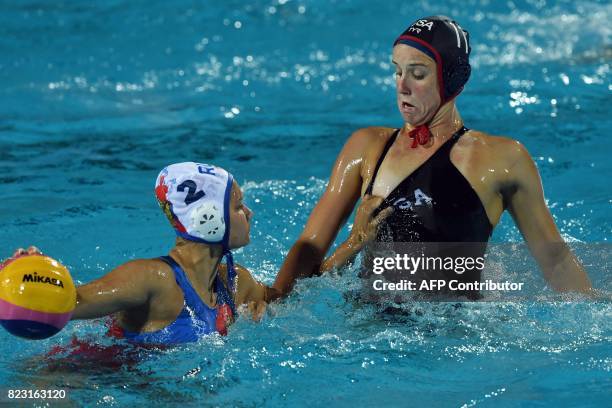 Makenzie Fischer vies with Verinika Vakhitova of Russia in 'Hajos Alfred' swimming pool on July 26, 2017 in Budapest during a semifinal match of...