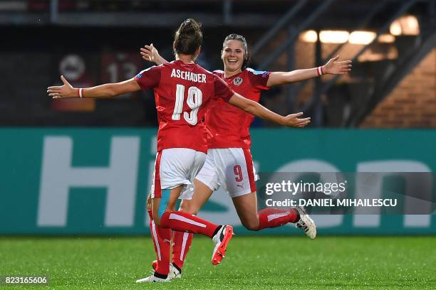 Austria's Sarah Zadrazil celebrates with teammate Verena Aschauer after scoring a goal during the UEFA Women's Euro 2017 football match between...