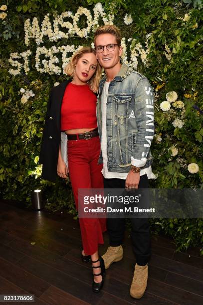 Tess Ward and Oliver Proudlock attend the Maison St-Germain opening night at 2 Soho Square on July 26, 2017 in London, England.