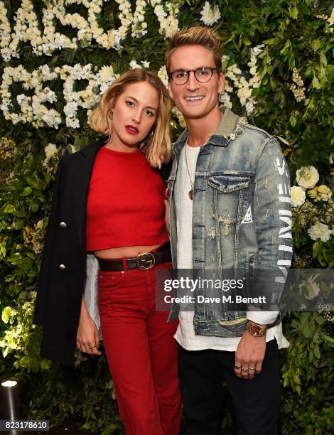 Tess Ward and Oliver Proudlock attend the Maison St-Germain opening night at 2 Soho Square on July 26, 2017 in London, England.