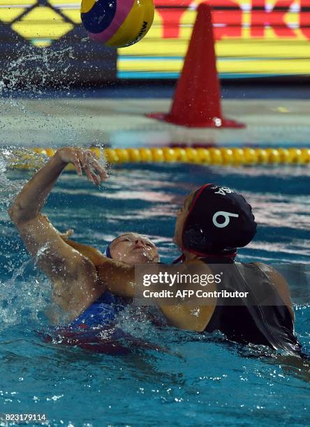 Captain Maggie Steffens vies with Elvina Karimova of Russia in 'Hajos Alfred' swimming pool on July 26, 2017 in Budapest during a semifinal match of...