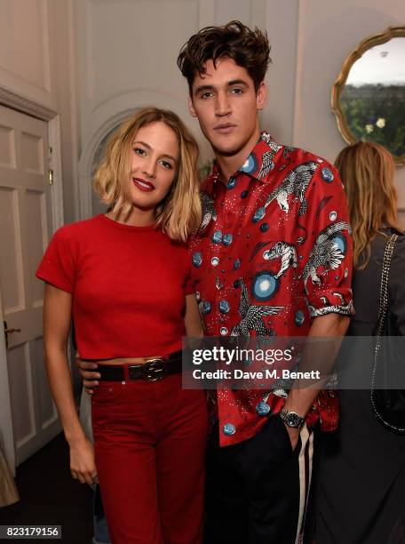 Tess Ward and Isaac Carew attend the Maison St-Germain opening night at 2 Soho Square on July 26, 2017 in London, England.